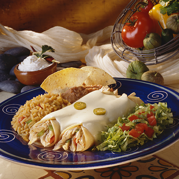 Chicken Enchiladas plate with the sour cream sauce